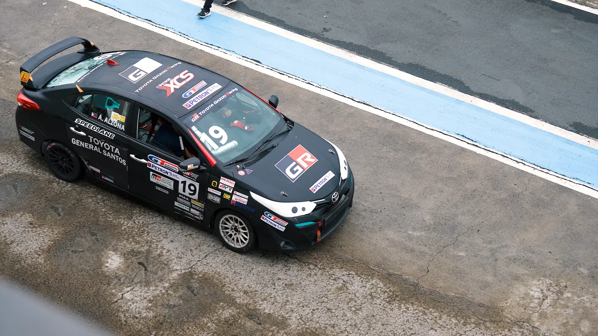 Black Toyota race car waiting in the motorsport paddock